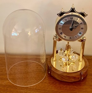 lot 101 image: Vintage Anniversary Clock with Glass Dome and Carousel Pendulum