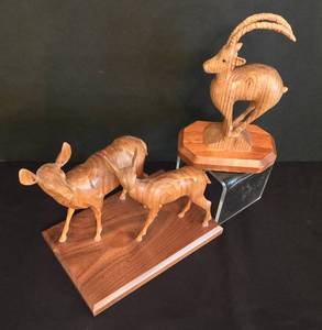 lot 129 image: Pair of Detailed Vern Johnson Wood Carvings
