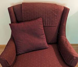 lot 244 image: Maroon Armchair and Ottoman