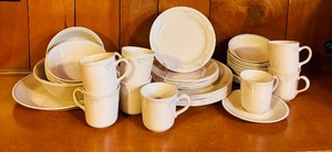 lot 292 image: Vintage Corelle Platter, Smaller Plate, Coffee Mugs, Saucers and Small Bowls in Cream with Light Blue Accents