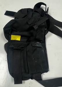 lot 26 image: Paintball holster holds tubes,  accessories and tanks