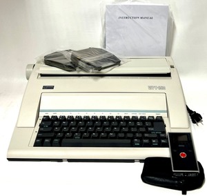 lot 237 image: NAKAJIMA WPT - 150 Electric Typewriter with MINO - FLIP Video pocket Camcorder with Case