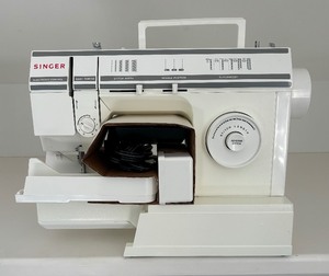 lot 79 image: New 17 Stitch Function Sewing Machine by Singer
