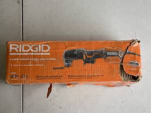 lot 488 image: RIDGID 4 Amp Corded Oscillating Multi-Tool R28700
