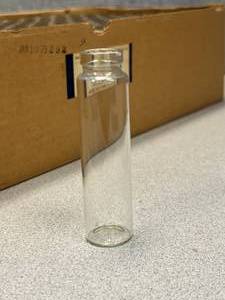 lot 47 image: Box of Automatic Machine Made Patent Lip Vials 8 Dram Short Style 95 x 25mm