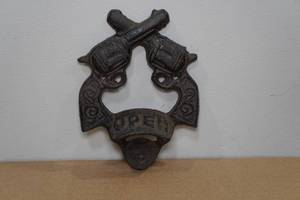 lot 54 image: Cast Iron Crossed Pistols Wall Bottle Opener