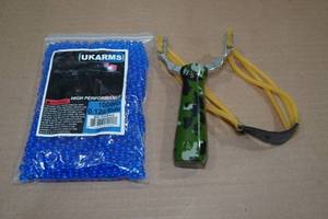 lot 96 image: Slingshot with .12g Pellets