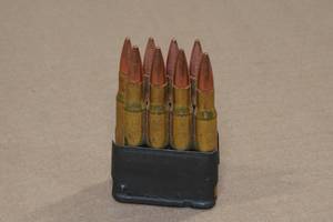 lot 144 image: Metal Cartridge with .30-06 Sprg FMJ Ammo