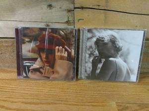 lot 106 image: Lot of 2 Taylor Swift CDs Folklore and Red Taylors Edition