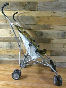 lot 142 image: Costco Camo Umbrella Dino Stroller