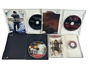lot 9 image: Used M Video Game Lot - PS2, Wii, and PSP - Killzone, The House of Dead, Call of Duty World at War, and Prince of Persia Revelations