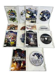 lot 13 image: Used Lot of Nintendo Wii Games including Transformers, Vahalla Knights, Super Smash Bros Brawl, and More