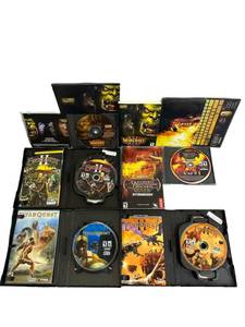 lot 77 image: T PC Video Game Lot including War Craft 3, Dungeons & Dragons, Everquest 2, and Titan Quest
