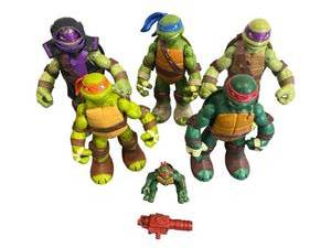 lot 85 image: 1993 4 TMNT Raphael Jump Attack Figure with 2012 Viacom Playmates TMNT Lot and 2012 TMNT Shellraiser Assault Van Vehicle Canon