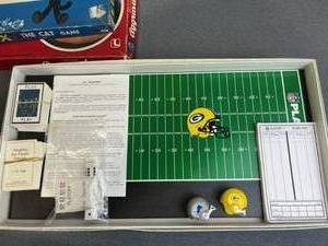 lot 127 image: Neat Family Board Game Lot including 1986 Stranded (New Sealed), 1960 Felix The Cat, 1991 NFL Playoffs Green Bay Packers, and More