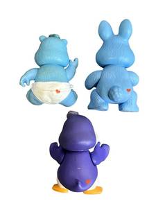 lot 199 image: Vintage 1985 Care Bears Cousins Cozy Heart Penguin (3.5), Swift Heart Rabbit, and Baby Tugs Care Bear with signs of play wear