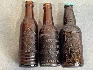 lot 212 image: Vintage Empty Ginger Beer and Soda Bottles - Old English Ginger Beer 7 oz, ACE Ginger Beer, Sioux City Birch Beer, Coca Cola Pine City MN, and More