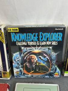lot 236 image: Factory Sealed Macintosh Knowledge Is Power Laser Mac CD-ROM, Xavix PORT Interactive Video Game Console (Untested, No Power adapter), Jackie Chan Studio Fitness J-MAT Xavix PORT Game, Xavix PORT Bowling, and More