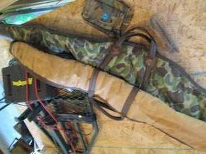 lot 54 image: Hunting tree stand, 2 gun cases and...