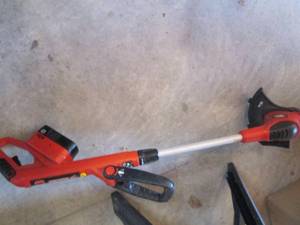 lot 56 image: Battery powered Black n Decker weed...