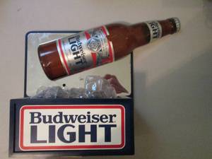 lot 185 image: Miller Lite Bottle being poured ove...