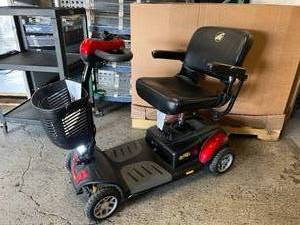 lot 5 image: MSRP $2000 Golden Technologies GB147 Buzzaround XL Lightweight 4 Wheel Power Mobility Scooter W Manual &amp NEW IN BOX Batteries - Red -Disassembles For Travel - Excellent Working Condition Arms Have Wear - See Pics &amp YouTube Video&nbsp