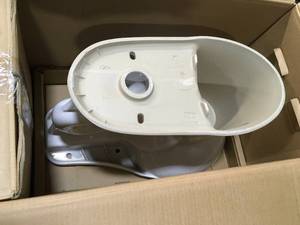 lot 5 image: New Glacier Bay 10 inch Rough In Two-Piece 1.28 GPF Single Flush Round Toilet in White Seat Included Model # N2428R-10 (Tank is cracked)
