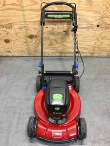 lot 7 image: Used Toro 60V Max 22 in. Recycler wPersonal Pace & SmartStow Lawn Mower with 4Ah Battery and Charger Model # 21466
