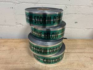 lot 198 image: EMPIRE Case of 4 Rolls of- CAUTION STORM DRAIN LINE Tape (3 x 1000 per roll)