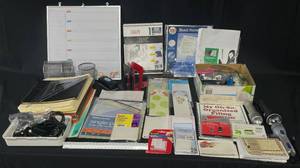lot 57 image: Large Lot of Home Office Items inc. Wall Hanging White Board, Various Loose Leaf Papers, Book Ends, File Folders, Sheet Protectors, Recipe Cards, Flashlights (untested), Variety of Chargers, Protractors and Compasses and More