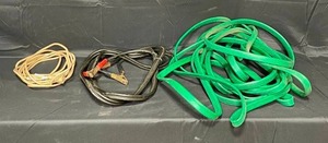 lot 11 image: Garden Hose  Jumper Cables  Extension Cord