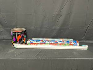 lot 23 image: Christmas Wrapping Paper and Tin Can with Bows