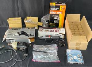 lot 66 image: Two Drills, Various Lightbulbs, Small L Brackets and Screws, Shower Rings, Birds Off, Other Hardware and More