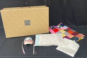 lot 78 image: VTG Lovesac Box, Decorative Porcelain Mask (hand painted), Small Quilted Blanket and Pillow