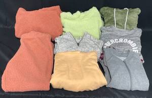 lot 130 image: Lot of Juniors Sweaters and Sweatshirts. Various Sizes, Styles, Colors and Brands