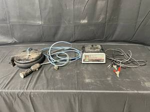 lot 192 image: 62amp Dual Rate Manual Battery Charger  Wind up Extension Cord