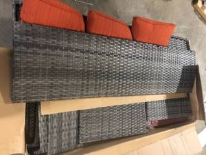 lot 23 image: Megon Holly Gray 3-Piece Wicker Outdoor Patio Conversation Seating Sofa Set with Orange Red Cushions by XIZZI Customer Returns See Pictures