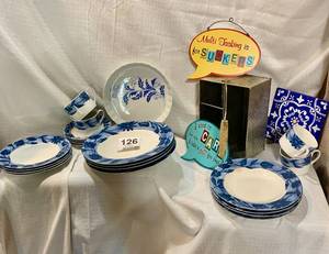 Blue dish set of 4. DISHES Cups, saucers, small plates large plates (a small  chip out of one larger plate, serving dish and trivet
