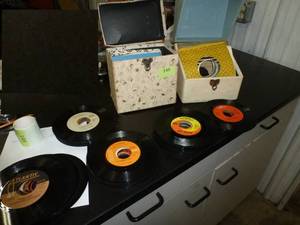 Sixty 45rpm records and 2 carrying cases