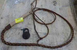 Leather whip and a vintage Strong Lever lock with key