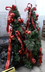 Two christmas trees and a stand that all match