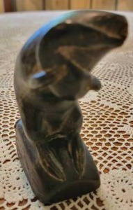 lot 6 image: Inuit Carved Otter with Fish Statuette Attributed to Nowya Qinuajua