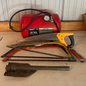 lot 118 image: Mixed LOT Bow Saws  5 Gallon Air Tank  Hand Saws  Folding Shovel
