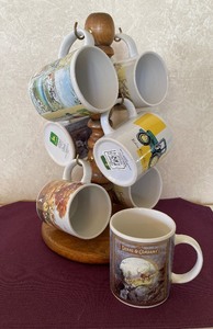 lot 57 image: Jophn Deere Mugs (7) and Mug Rack