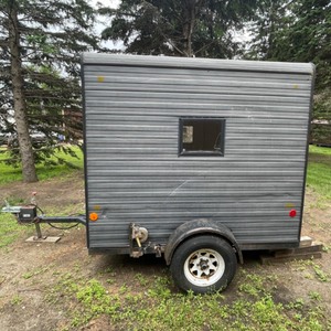 lot 108 image: 1975 Calkins Permanent 5 Hole Fish House Pull Behind