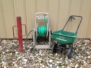 lot 83 image: Mixed LOT Garden Hose Cart  Scotts Broadcast Spreader  Fence Post Driver