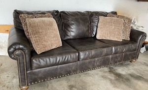 lot 306 image: Ashely Furniture Faux Leather and Nailhead Trim SofaCouch