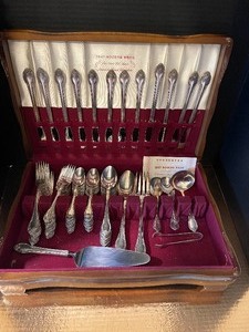 lot 107 image: Roger Bros. Flatware 1847 Remembrance Pattern with Box Serving Set for 12 84 pieces total