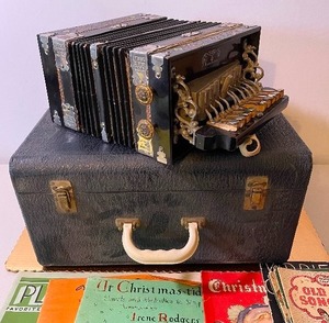 lot 187 image: The Horse Shoe Brand Accordion, Case and Sheet Music