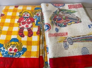 lot 196 image: Two Vintage Childrens Satin Trim Blankets - Raggedy Ann, Cars